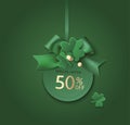 St Patrick`s day sale design template. Green price tag with clover leaves and bow on green background.