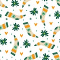 St. Patrick's Day seamless vector pattern. Festive socks, clover leaves and hearts for good luck. Irish holiday