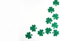 St. Patrick`s Day side border paper shamrocks on white background. Royalty Free Stock Photo