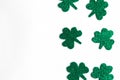 St. Patrick`s Day side border paper shamrocks on white background. Royalty Free Stock Photo