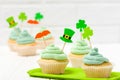 St. Patrick`s Day theme colorful horizontal banner. Cupcakes decorated with green buttercream and craft felt decorations in form
