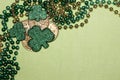 St. Patrick`s Day Themed Background with Beads, Coins and Clover