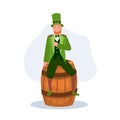 St Patrick's Day Celebration. man in Leprechaun Costume sitting on oak barrel