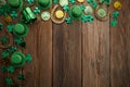 St Patricks Day border of shamrocks and coins over a rustic wood background Royalty Free Stock Photo