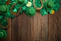 St Patricks Day border of shamrocks and coins over a rustic wood background Royalty Free Stock Photo