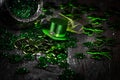 St. Patricks Day composition. Shamrocks, coins, leprechaun hat and silver pot on vintage style wood background.