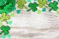 St Patricks Day corner border of shamrocks, leprechaun hat over white wood Royalty Free Stock Photo