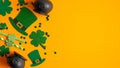 St Patricks Day frame of Irish elf hats, pots of gold, shamrock leaf clovers on orange background with copy space. Happy St Royalty Free Stock Photo
