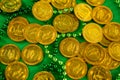 St Patricks Day gold chocolate coins and beads Royalty Free Stock Photo