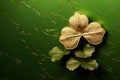 St Patricks Day gold three-leaf lucky clover shamrock on green background