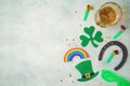 St Patricks day holiday concept with lucky charms, shamrock and beer glass on rustic background