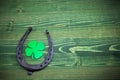 St. Patricks day, lucky charms on green wooden background Royalty Free Stock Photo