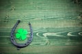 St. Patricks day, lucky charms on green wooden background Royalty Free Stock Photo