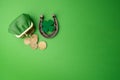 St. Patricks day, lucky charms. Horesechoe and shamrock on green background Royalty Free Stock Photo