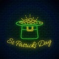 St. Patricks Day neon sign with leprechaun hat and gold. Green hat with treasure as Ireland national holiday symbol Royalty Free Stock Photo