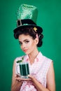 St. Patricks Day pinup girl with fashion hair. pretty girl in vintage style. pin up woman with trendy makeup. retro Royalty Free Stock Photo