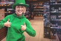 St Patricks day portrait of young woman. Leprechaun model girl in a wine store