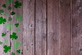 St Patricks Day shamrock side border on a dark wood background