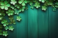 St Patricks Day side border of paper shamrocks over a green wood background Royalty Free Stock Photo