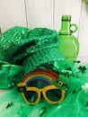green bottle, sparkly hat, rainbow glasses, tutu, - st patricks day celebation,