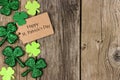 St Patricks Day tag with shramrock side border over wood Royalty Free Stock Photo