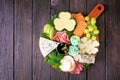 St Patricks Day charcuterie board overhead view against a wood background
