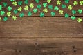 St Patricks Day shamrocks top border over rustic wood Royalty Free Stock Photo