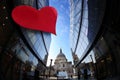 St Paul Cathedral against large heart on modern building during Valentine`s Day in London, UK