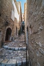 Medieval architecture: cobbled narrow alley shows the lifestyle of Saint Paul de Vence medieval village Royalty Free Stock Photo