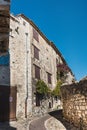 Medieval architecture: narrow, cobbled street in the medieval village of Saint Paul de Vence Royalty Free Stock Photo