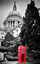 St Paul's Cathedral dome and red telephone booth. London, the UK.