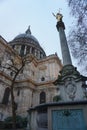 St Paul`s Cathedral from a low angle with statue in foreground