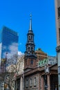 St. Paul`s Chapel of Trinity Church Wall Street in the background is Seven World Trade Center with clouds and Royalty Free Stock Photo