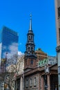 St. Paul's Chapel of Trinity Church Wall Street in the background is Seven World Trade Center with clouds and Royalty Free Stock Photo