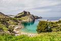 St. Pauls bay, Lindos acropolis in background on Rhodes, Greece