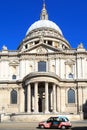 St Pauls Cathedral on a bright summer day, with an iconic London Taxi in the foreground.