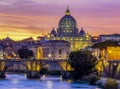 St. Peter\'s basilica dome and St. Angel bridge over Tiber river at sunset in Rome, Italy Royalty Free Stock Photo
