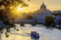 St. Peter`s basilica dome and St. Angel bridge over Tiber river at sunset in Rome, Italy Royalty Free Stock Photo