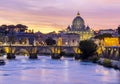 St. Peter`s basilica dome and Victor Emmanuel II bridge over Tiber river at sunset, Rome, Italy Royalty Free Stock Photo