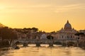 St. Peter`s cathedral and Tiber river at sunset in Rome Royalty Free Stock Photo