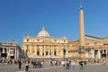 St. Peter`s Square and St. Peter`s Basilica, Vatican City in the day time with tourist around. Italy