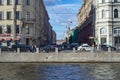 Long straight street across the river with heavy traffic