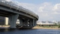 Cable-stayed bridge across the Neva River. Sandy shore.