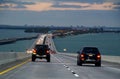 St Petersburg, Florida, U.S.A - February 18, 2021 - The traffic on on Bob Graham Sunshine Skyway Bridge during sunset