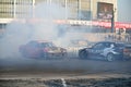 Racing cars on the track drift in the smoke at the World car show at the CCM