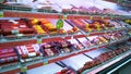 Top Supermarket - one of biggest retailer. Retail industry. Shelves with sausage and lunch meat products. Grocery shopping.