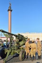 Actors in the form of soldiers around anti-aircraft guns at the