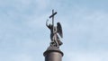 Close up of a sculpture of Angel with a cross on a top of Alexander Column on the Palace