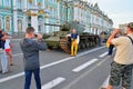 People photographed against the backdrop of Soviet heavy tank KV-1 on the background of the Winter Palace