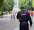 St. Petersburg, Russia - August 4, 2018: A policeman patrols the park near the football stadium.